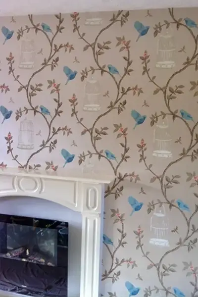 feature fireplace wall with wallpapered finish